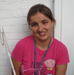 Girl smiling and holding white cane